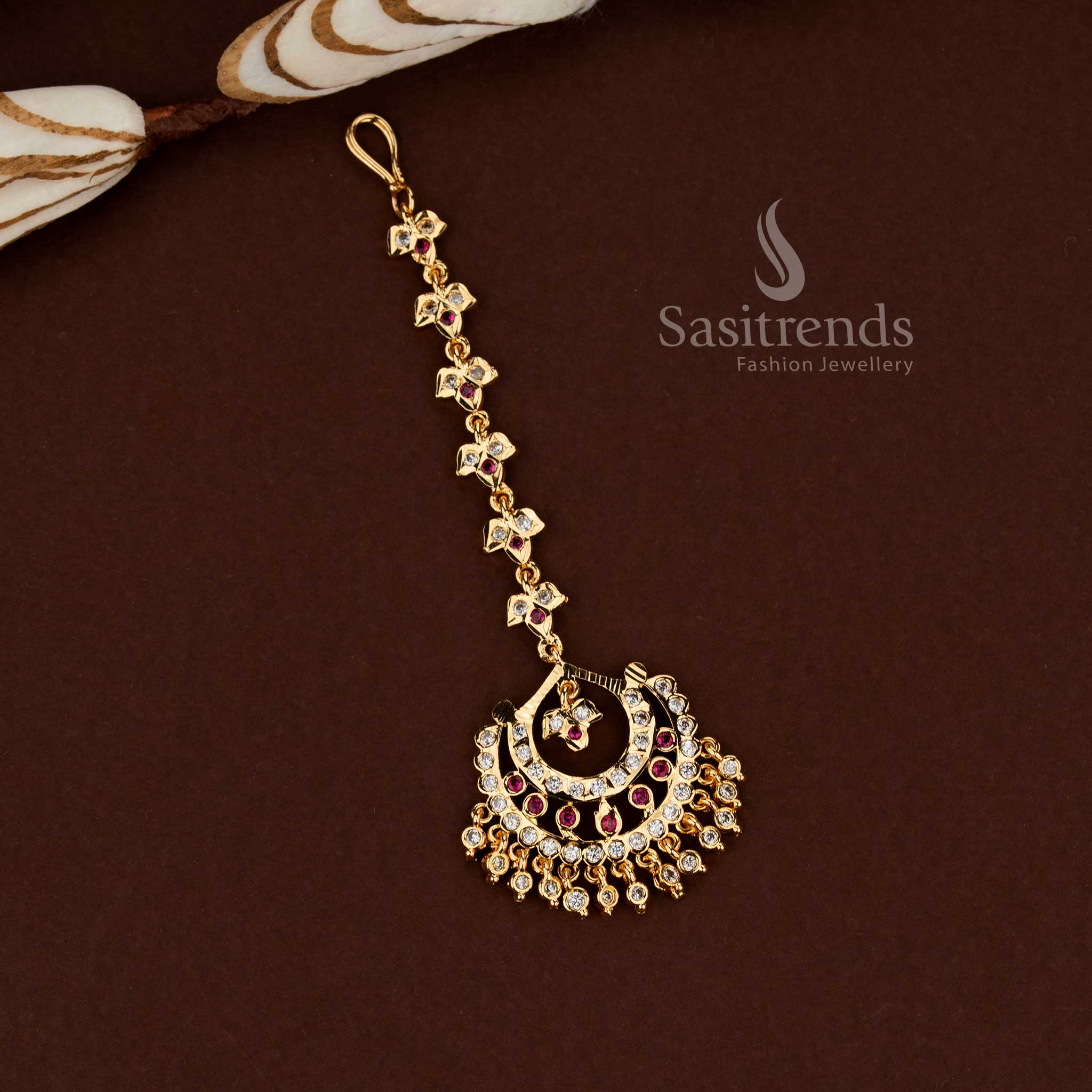Regal white ruby stone crescent design Impon micro gold plated AD maang tikka perfect for wedding styling festive functions and elegant bridal ornamentation - Sasitrends