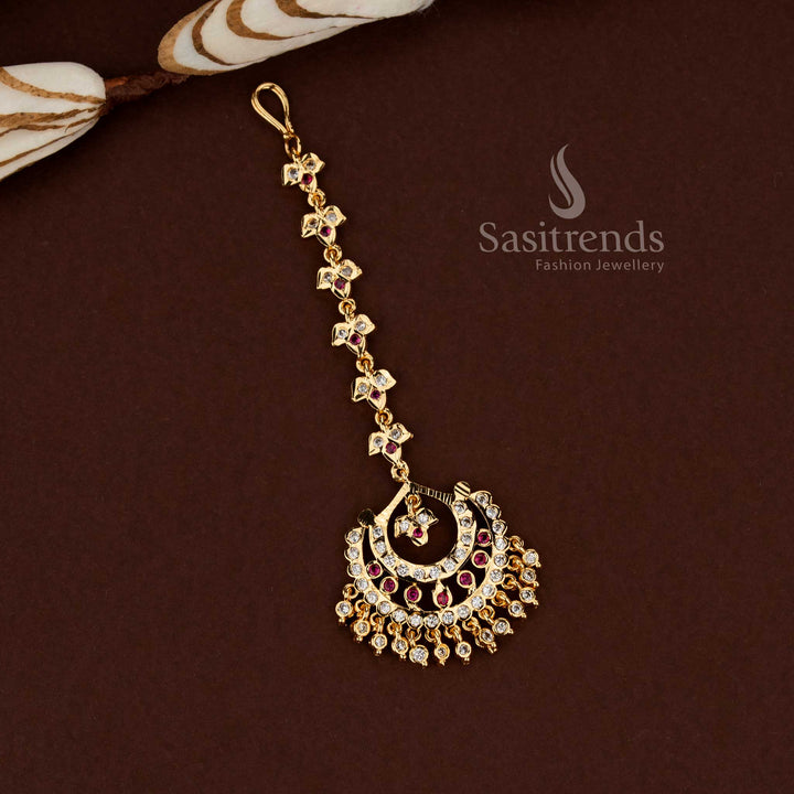 Regal white ruby stone crescent design Impon micro gold plated AD maang tikka perfect for wedding styling festive functions and elegant bridal ornamentation - Sasitrends