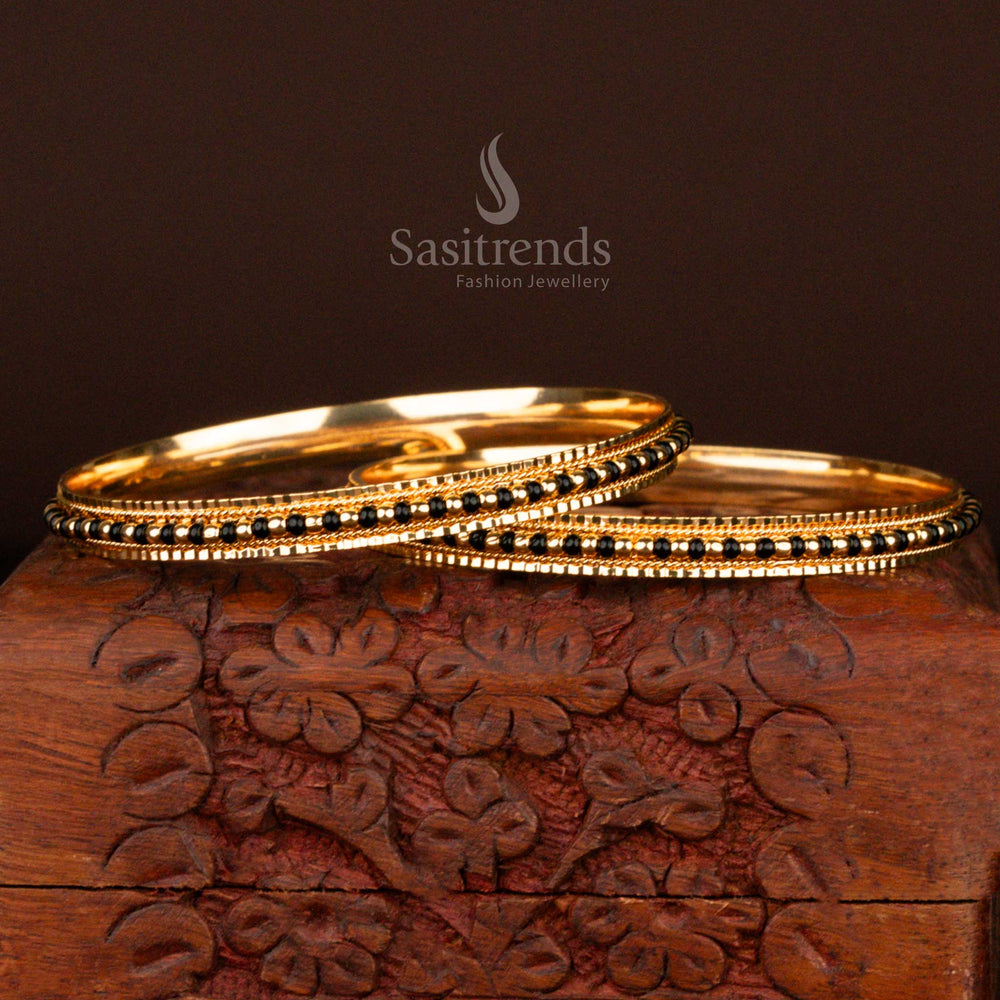 Graceful traditional micro gold plated black bead bangles for women featuring an ethnic touch and antique glow, perfect for festive occasions and temple visits – online exclusive by Sasitrends