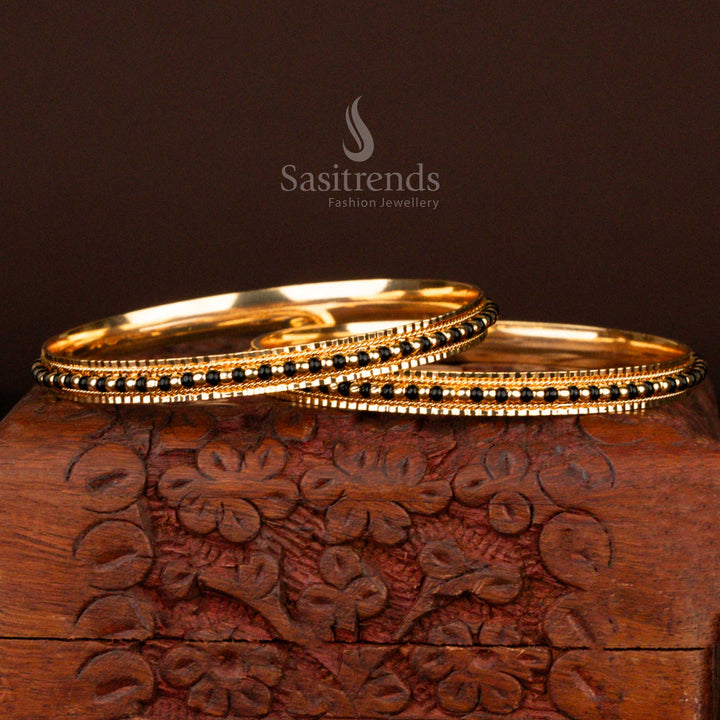 Graceful traditional micro gold plated black bead bangles for women featuring an ethnic touch and antique glow, perfect for festive occasions and temple visits – online exclusive by Sasitrends