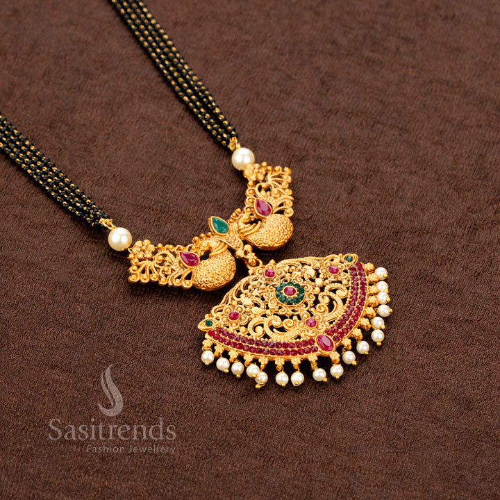 Elegant and classic matte gold necklace jewellery set showcasing a beautifully sculpted peacock and floral pendant, paired with traditional jhumka earrings—exuding graceful ethnic charm and timeless sophistication - Sasitrends
