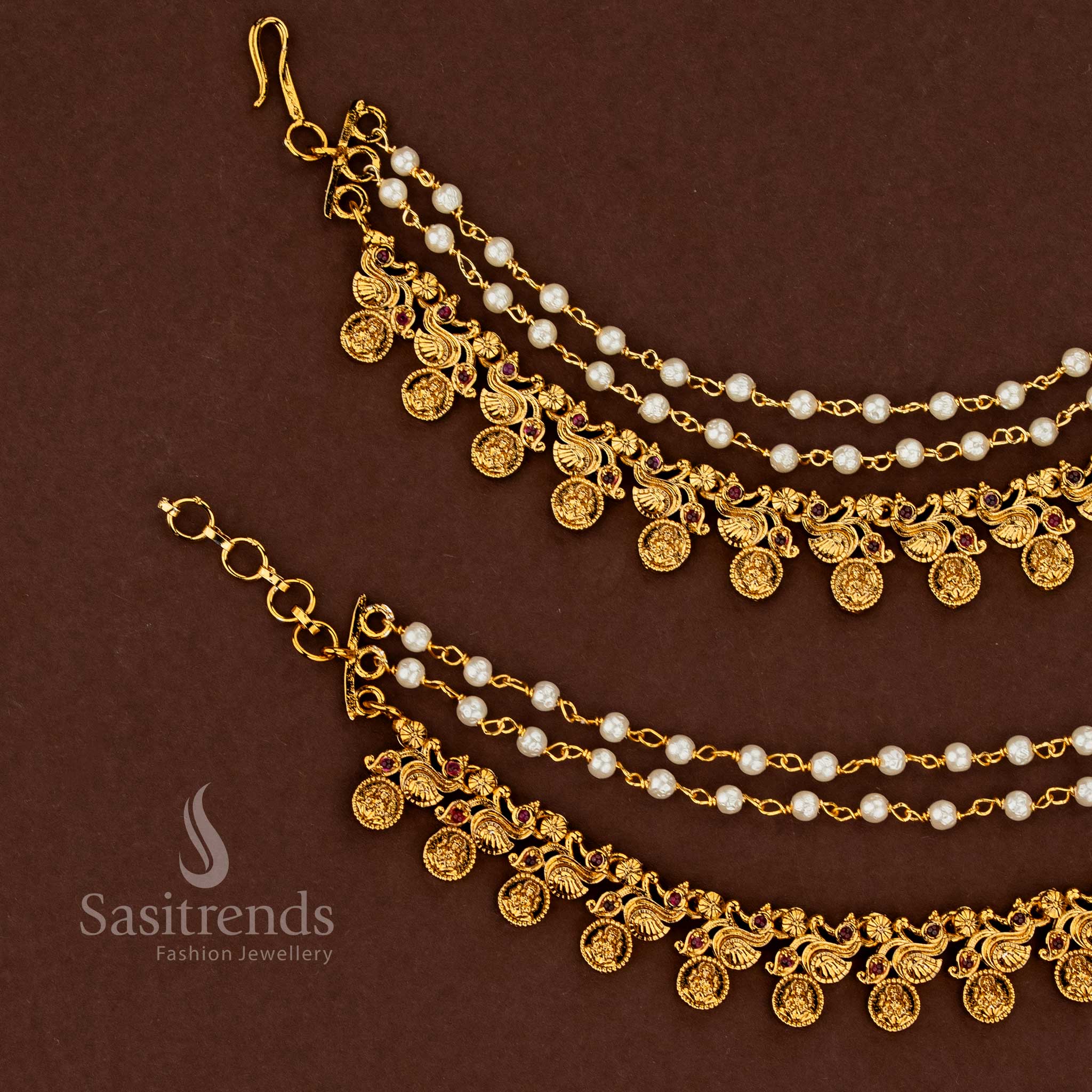 Aishwarya inspired peacock Lakshmi temple gold finish American diamond matil ear chains enriched with glowing ruby settings and elegant pearl cascade for sacred wedding grandeur - Sasitrends