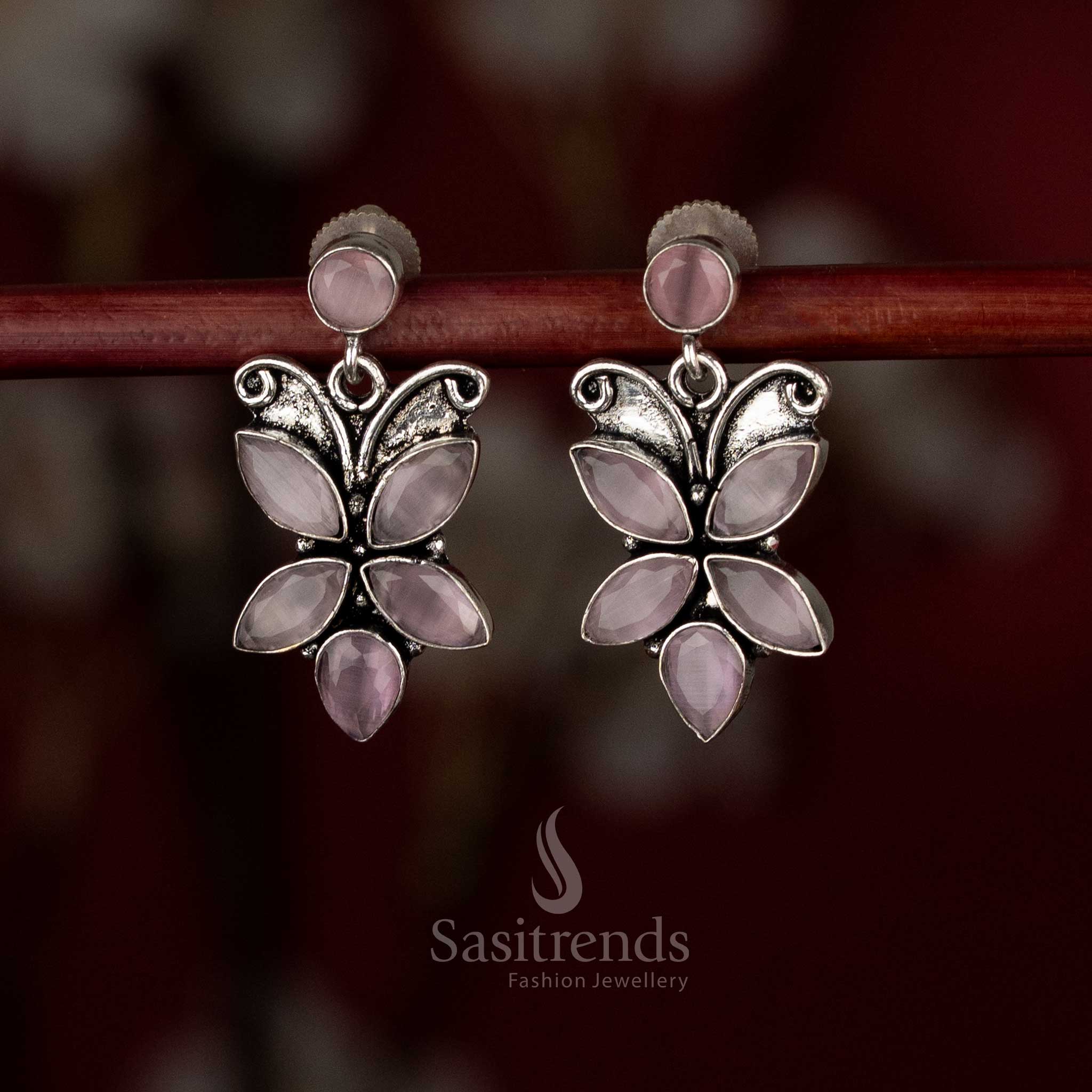 Blush pink oxidised butterfly earrings with gentle sway for feminine daytime wear – Sasitrends.