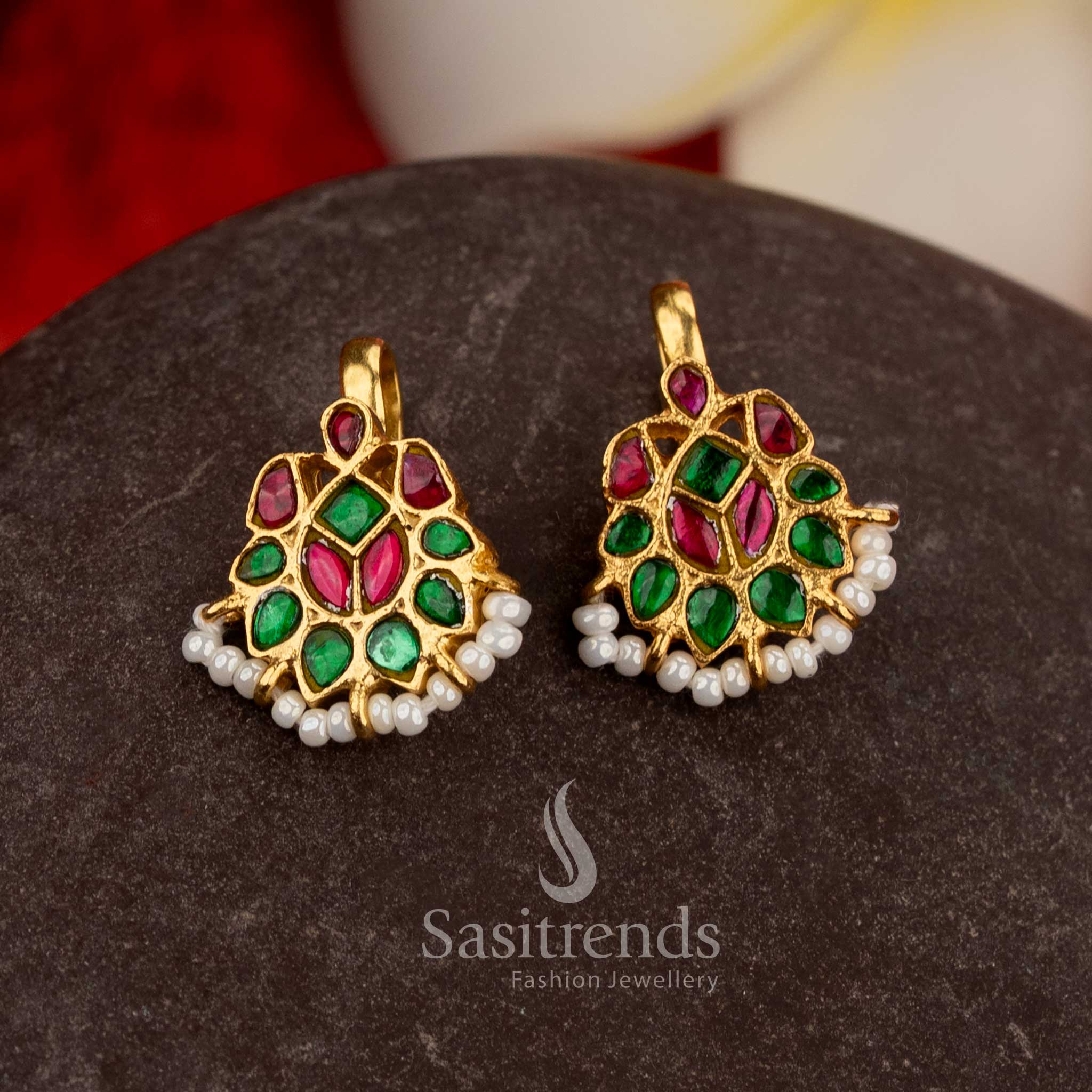Regal ruby green jadau teardrop leaf crescent bugadi earrings adorned with kundan stones pearls - Sasitrends
