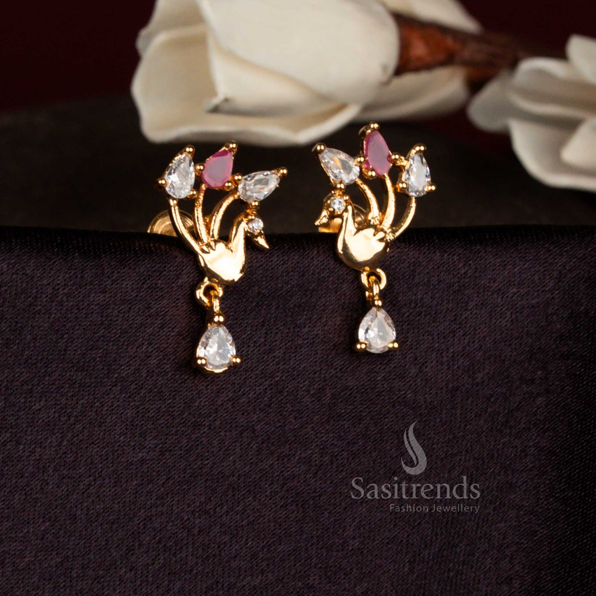 Heritage spark white ruby American diamond micro gold plated stylized peacock teardrop stud earrings perfect for festive functions, family ceremonies, and stylish gatherings – Sasitrends