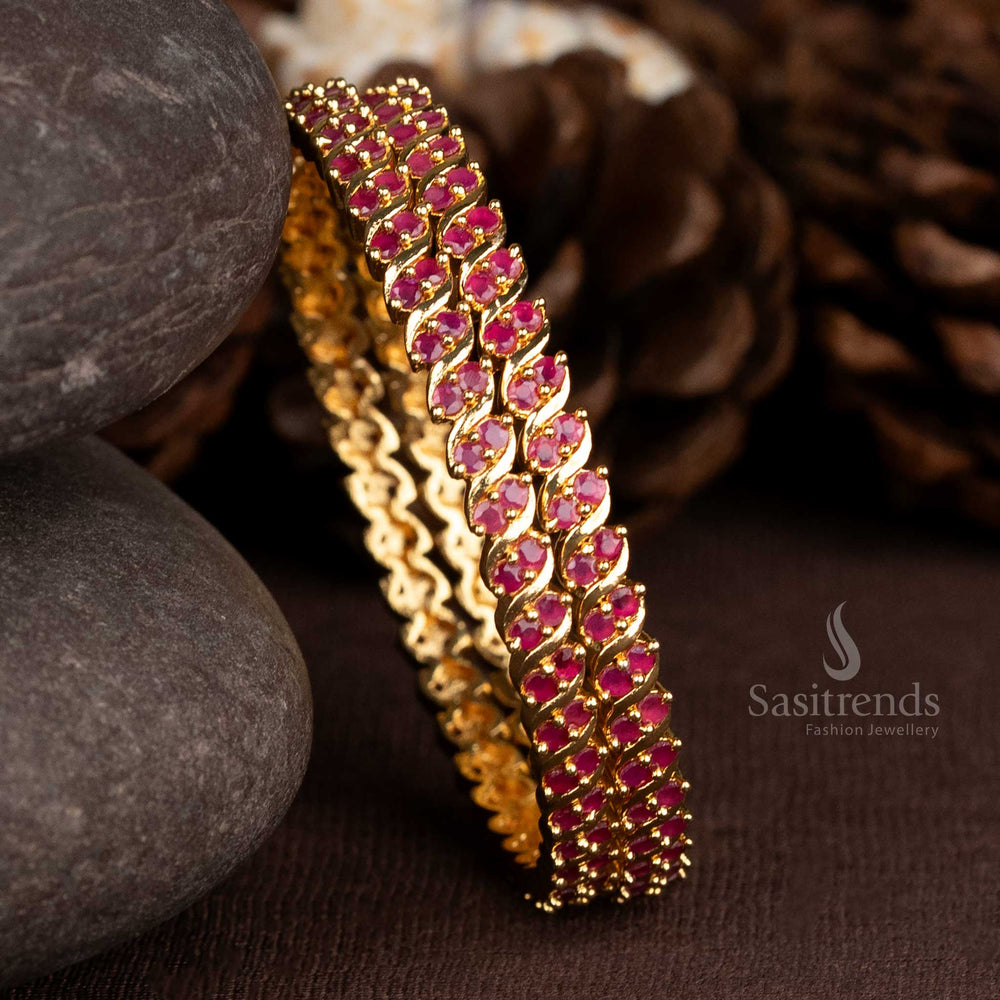 Royal spiral two line bangles in gold plating with bold ruby American diamonds, tailored for traditional brilliance and wedding ensemble beauty – Sasitrends

