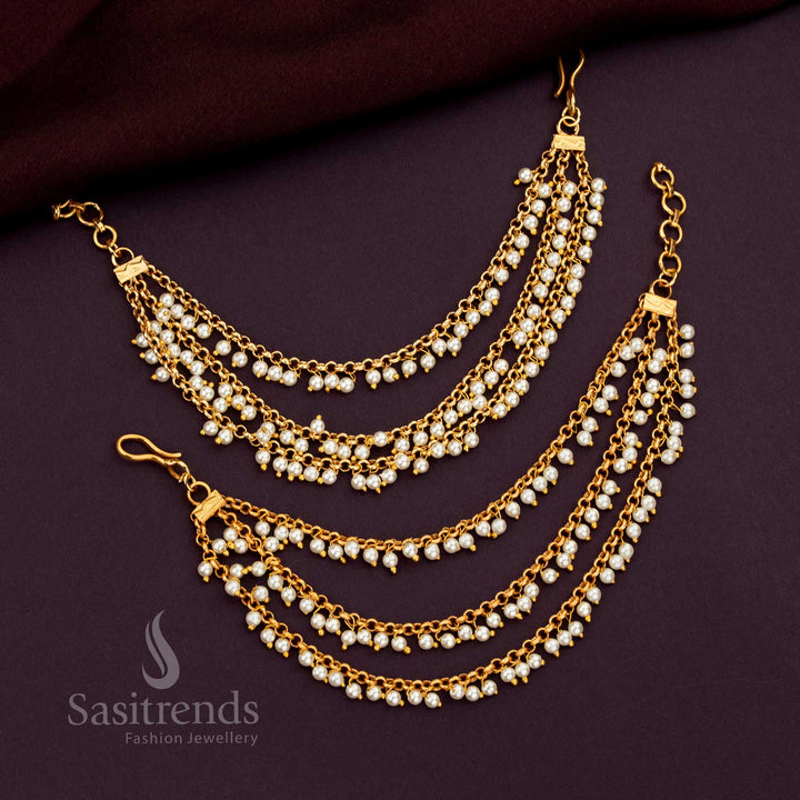 Opulent Three Layer Gold Plated Matil With Flowing Pearl Hangings Designed To Elevate Bridal Sarees And Designer Lehenga Ensembles - Sasitrends