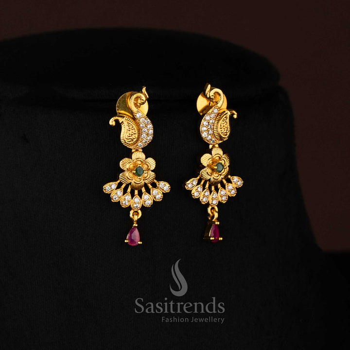 Heritage-style matte gold plated earrings featuring a refined peacock silhouette with intricate floral work and shimmering Multi kemp stone highlights, crafted for elegant festive and saree styling – Sasitrends