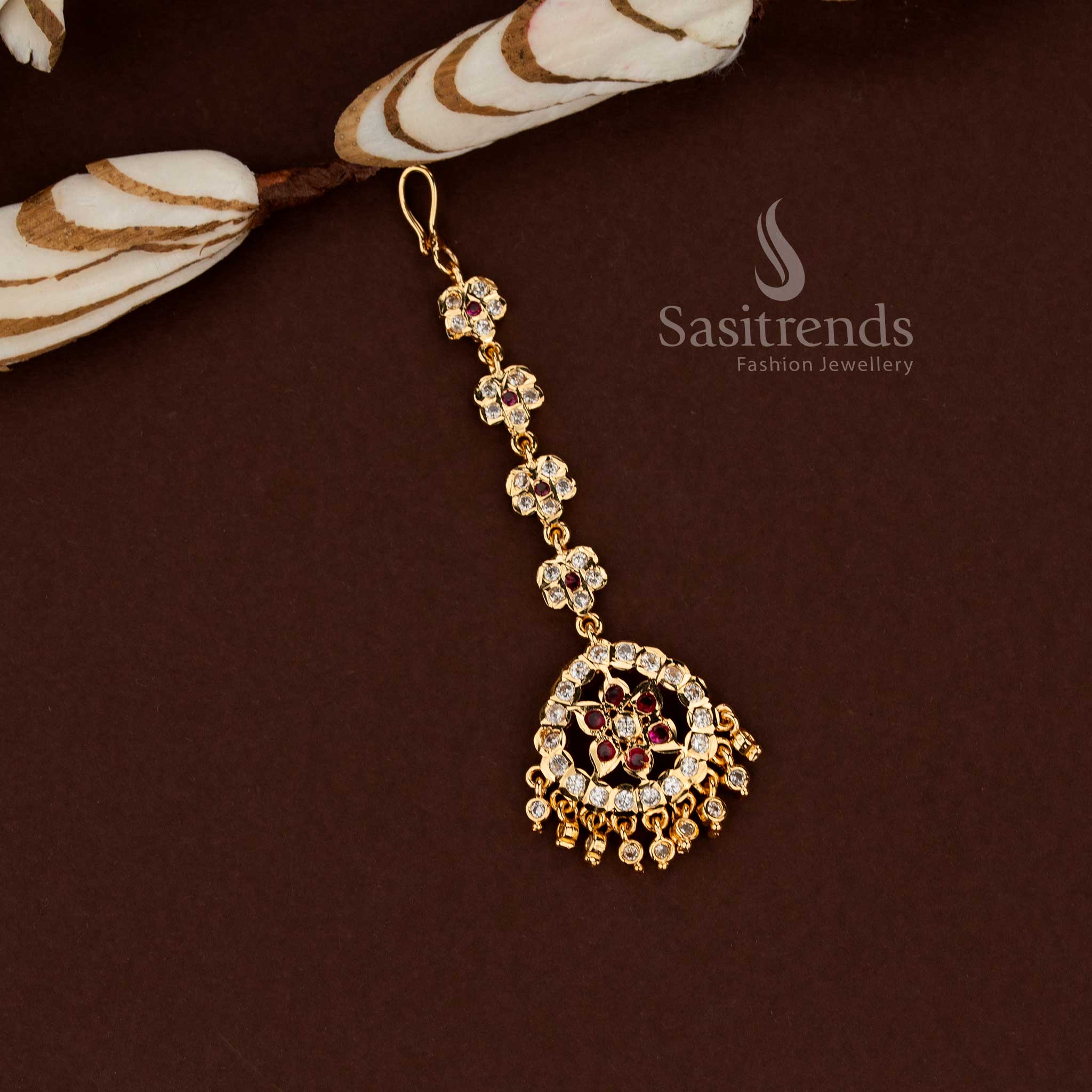 Royal white and ruby floral pattern Impon micro gold plated AD maang tikka styled for bridal wear wedding events festive celebrations and stylish ethnic fashion - Sasitrends