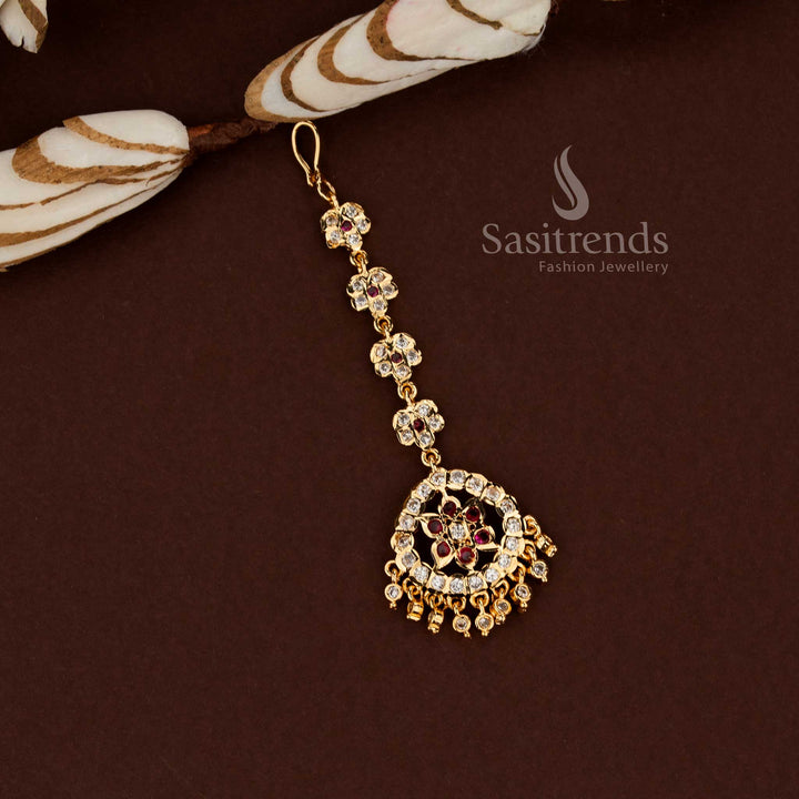 Royal white and ruby floral pattern Impon micro gold plated AD maang tikka styled for bridal wear wedding events festive celebrations and stylish ethnic fashion - Sasitrends