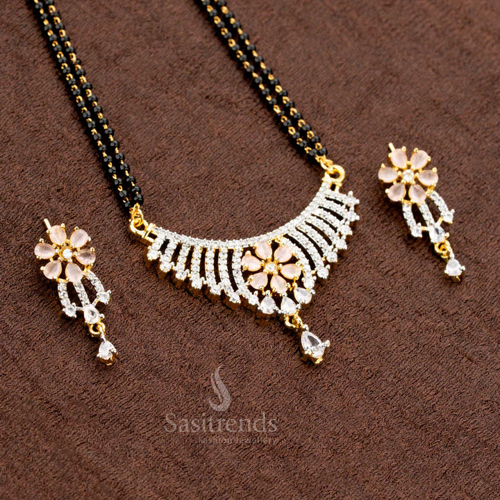 Dazzling pink floral motif pendant set with high-quality American Diamonds, featuring a Mangalsutra chain and matching earrings, a classic and elegant jewellery design - Sasitrends