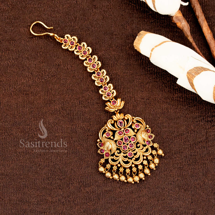 Traditional matte gold Lakshmi peacock mango tikka with classic AD accents, ideal for wedding grandeur and festive jewellery style elegance -sasitrends