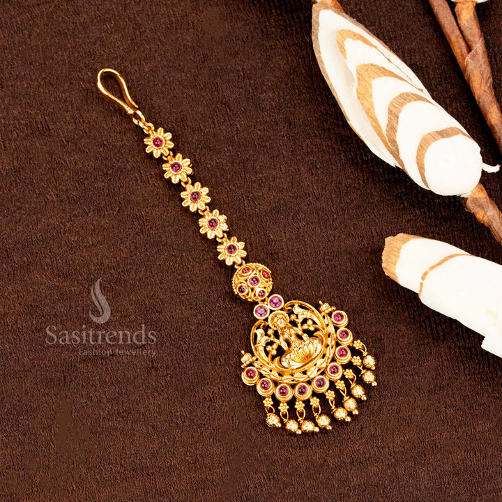 Classic temple jewellery style matte finish Lakshmi mango tikka featuring AD stones and ball hangings, bringing timeless bridal elegance -sasitrends