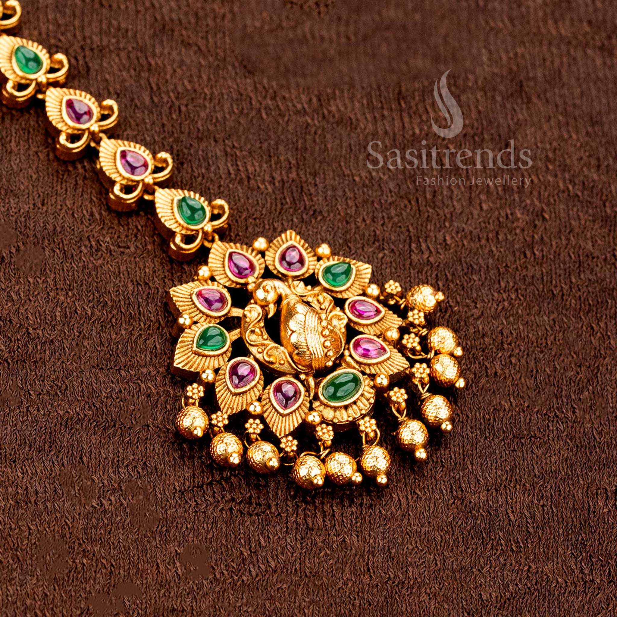 Inspired matte gold Lakshmi peacock floral tikka enhanced with AD sparkle, ideal for ethnic wedding jewellery style perfection -sasitrends
