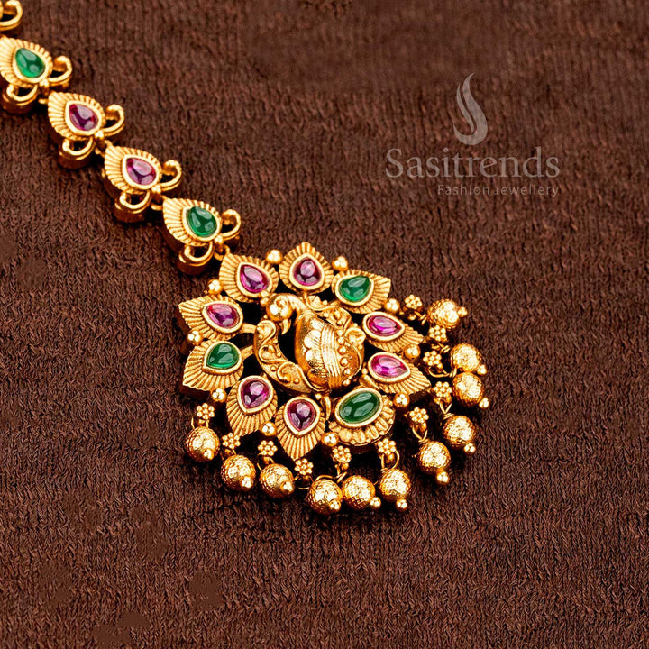 Inspired matte gold Lakshmi peacock floral tikka enhanced with AD sparkle, ideal for ethnic wedding jewellery style perfection -sasitrends