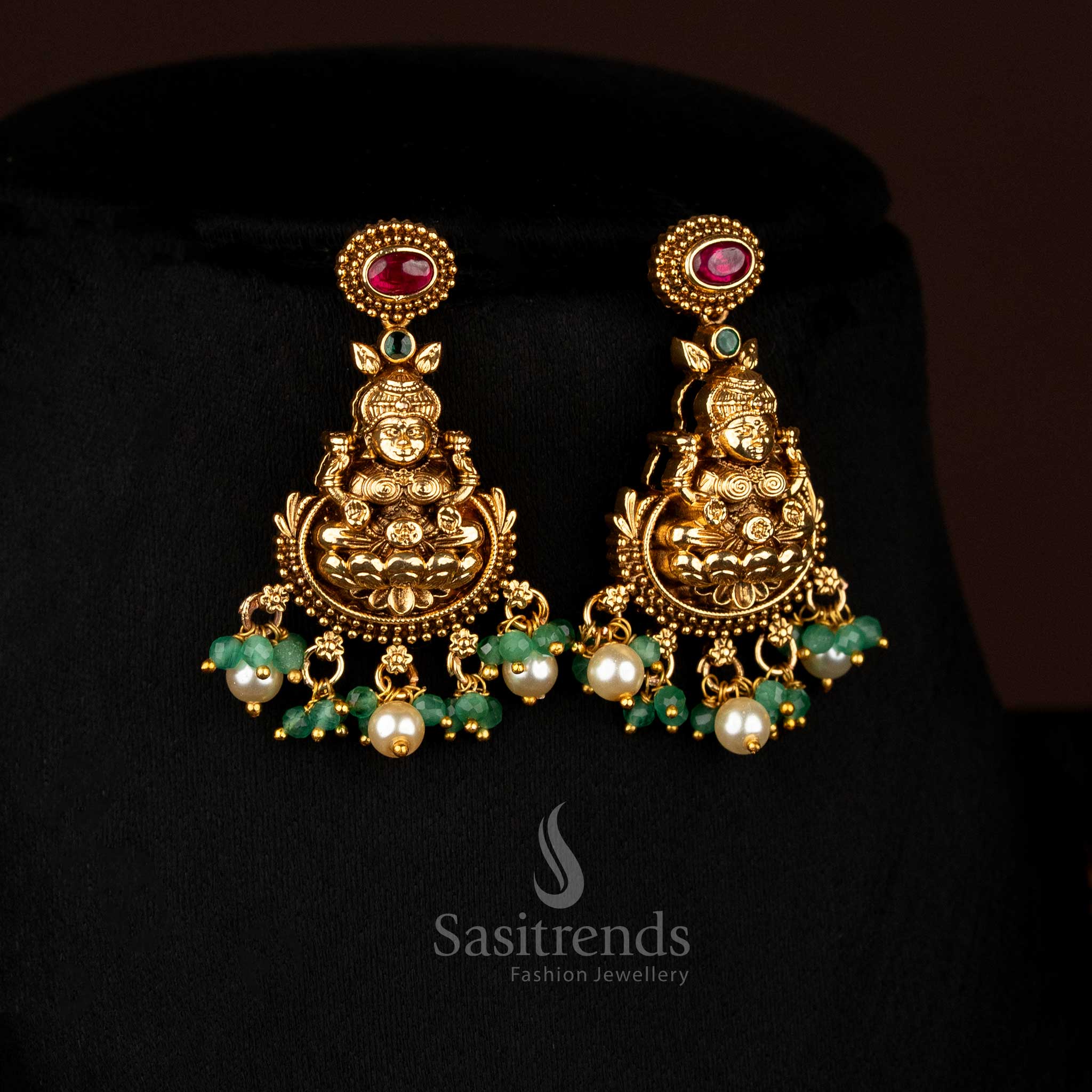 Majestic ruby-green matte gold plated lotus Lakshmi Earringsfeaturing pearl drops, designed to wear for festive occasions and cultural celebrations – Sasitrends