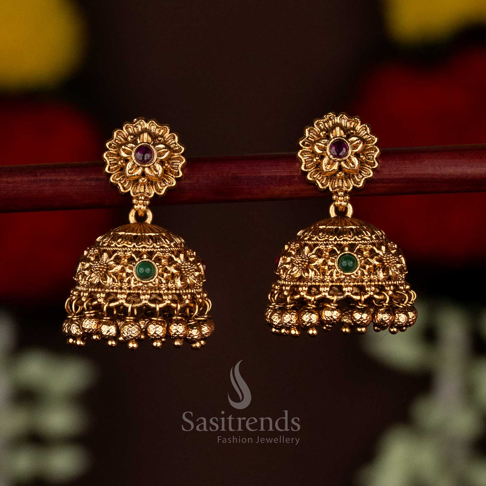 Charming ruby-green matte gold plated floral jhumka earrings adorned with hanging beads, crafted for traditional occasions and elegant cultural gatherings by Sasitrends
