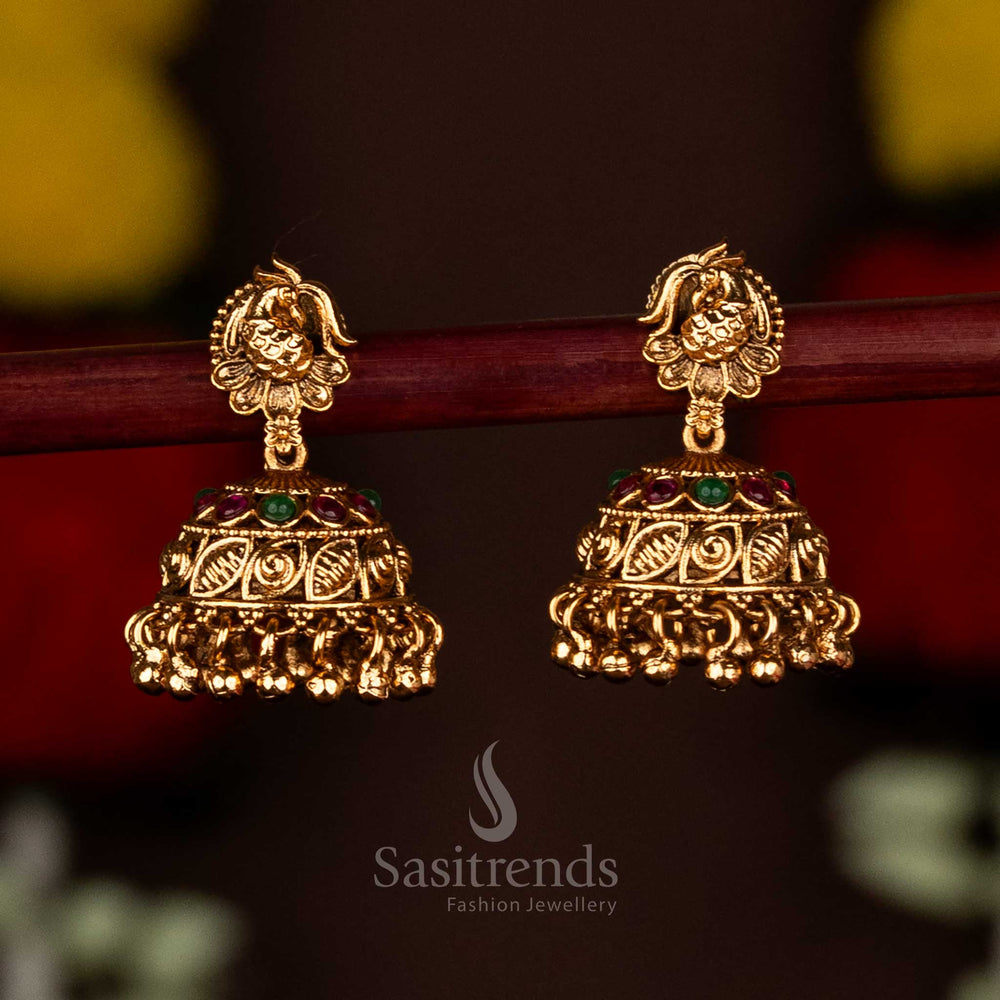 Graceful ruby-green temple matte gold plated peacock floral leaf jhumka earrings with hanging beads, designed for festive saree wear and ethnic grandeur by Sasitrends