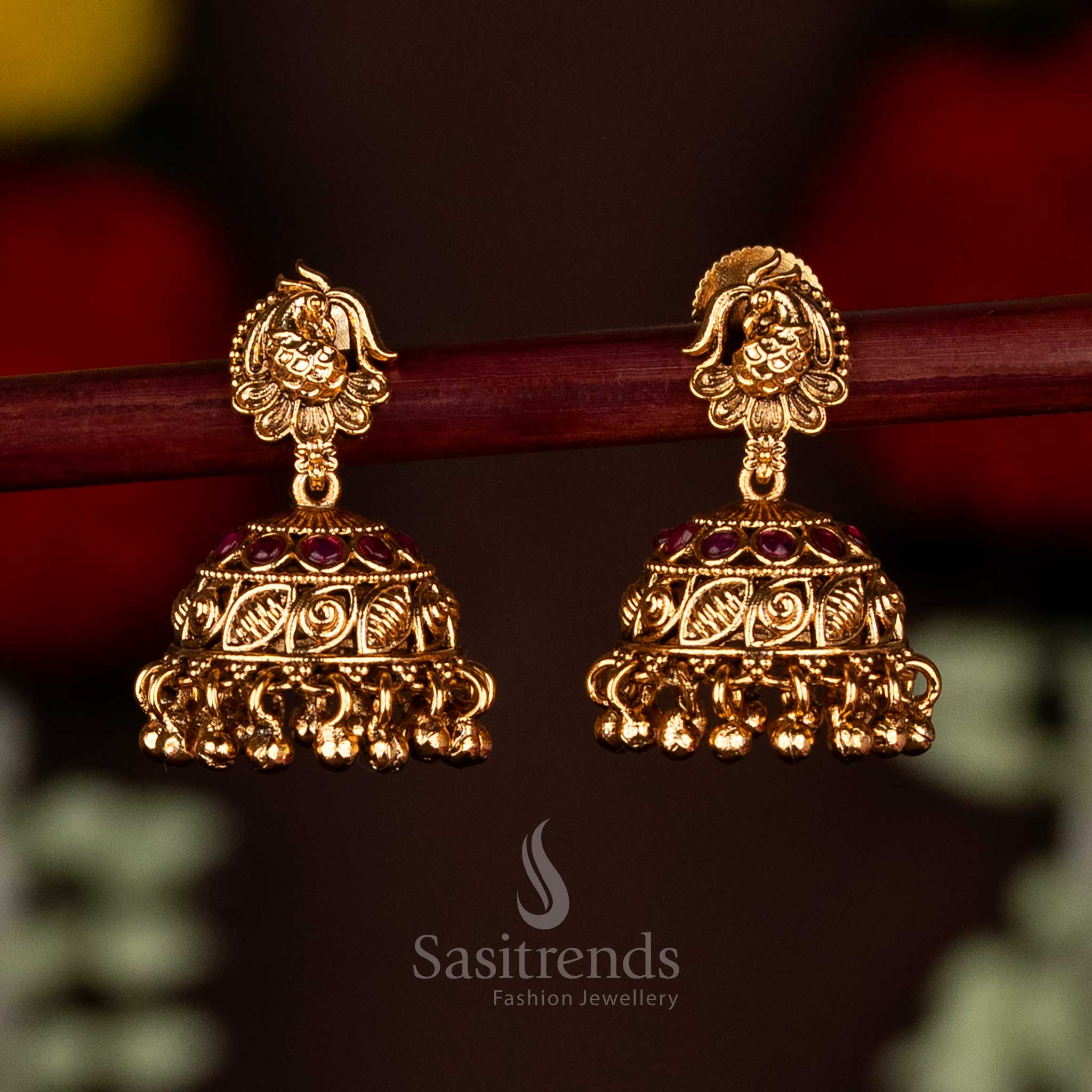 Elegant ruby matte gold plated peacock floral leaf jhumka earrings featuring delicate hanging beads, perfect for cultural celebrations and festive occasions by Sasitrends