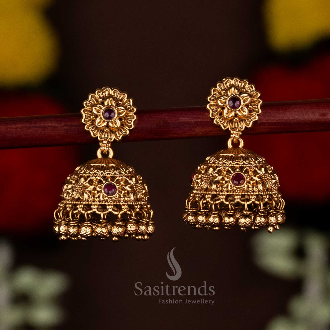 Beautiful ruby matte gold plated floral jhumka earrings featuring delicate hanging beads, perfect for cultural celebrations and festive occasions by Sasitrends