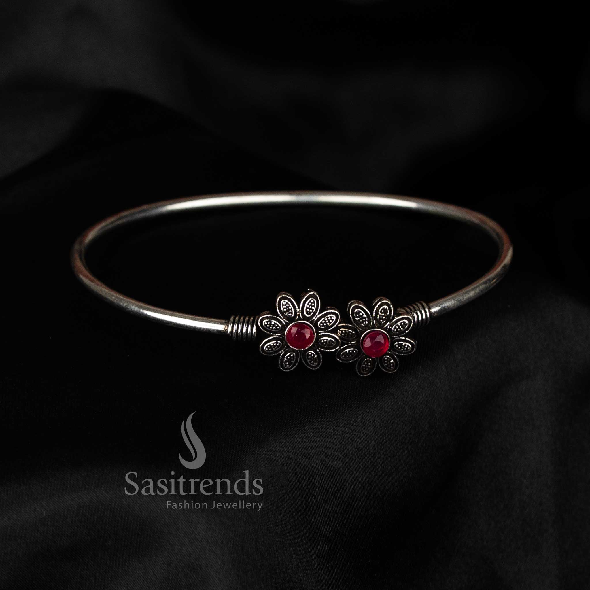 Oxidised floral stone bracelet with dual motif design in ruby shade, perfect for festive and casual hand jewellery styling – Sasitrends
