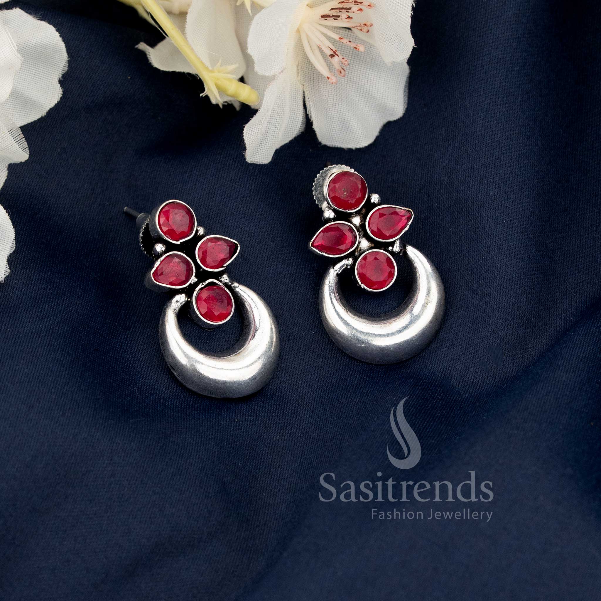 Ruby oxidised half moon floral motif earrings reflecting ethnic glamour, perfect for festive Navaratri evenings and saree adornment by Sasitrends