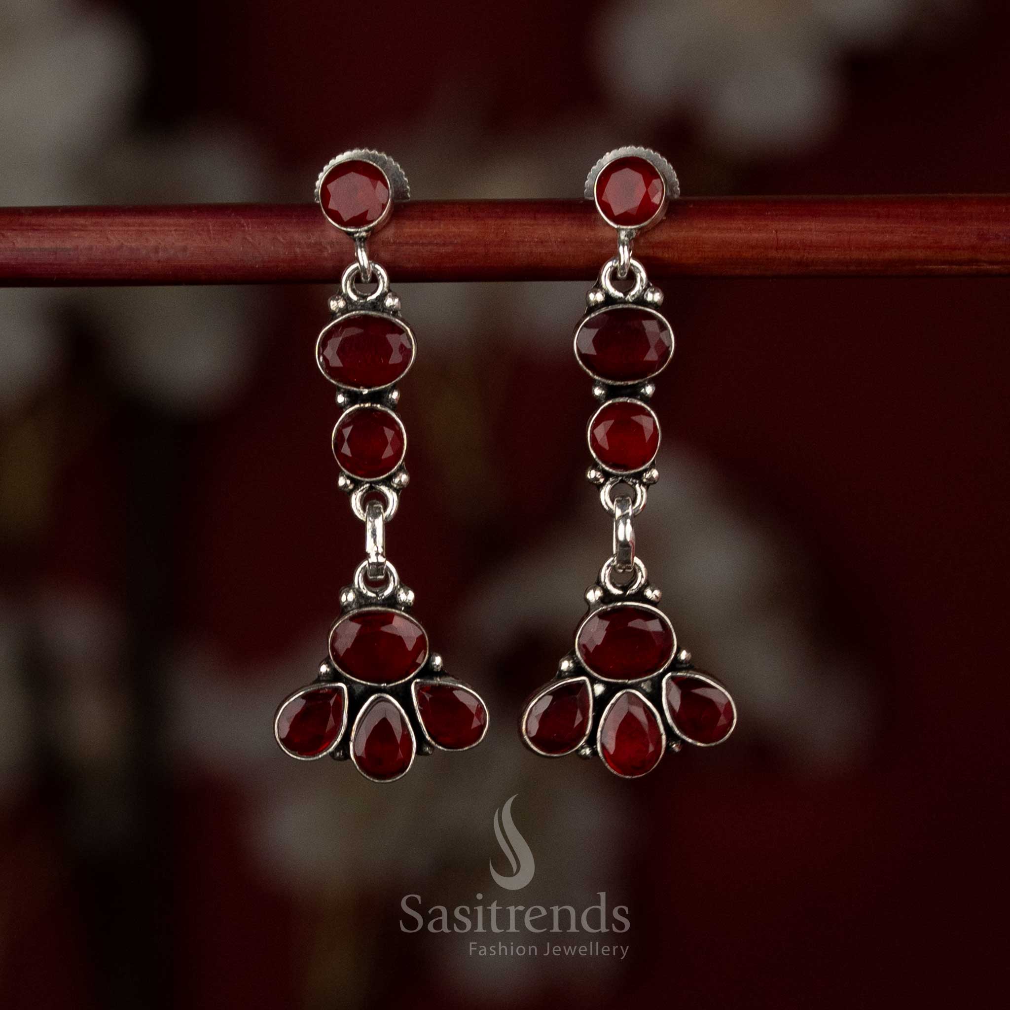 Ruby oxidised silver earrings featuring vertically linked floral tiers and elegant sculpted drops – Sasitrends