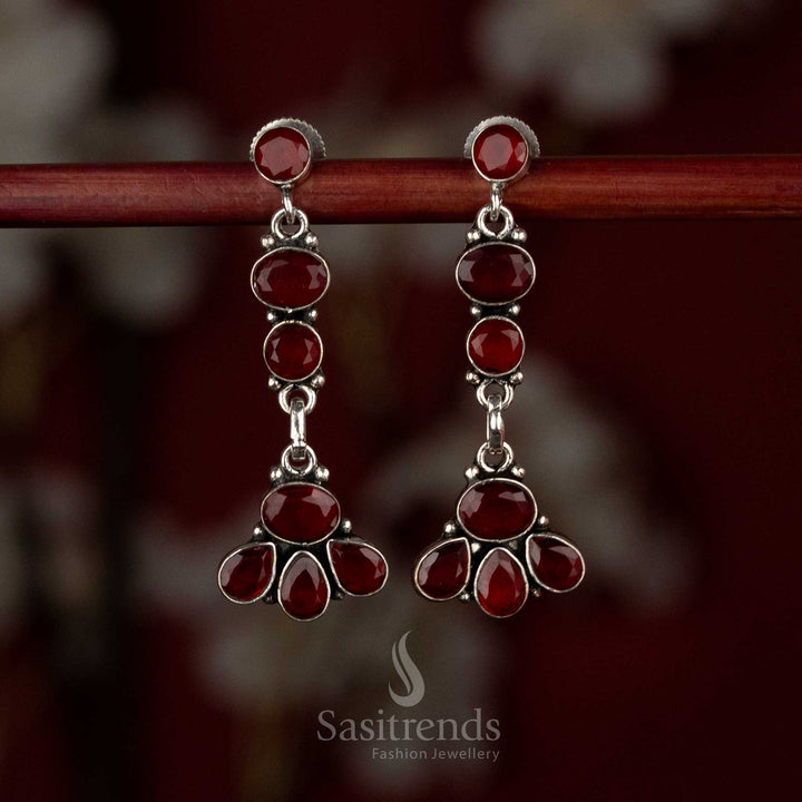 Ruby oxidised silver earrings featuring vertically linked floral tiers and elegant sculpted drops – Sasitrends