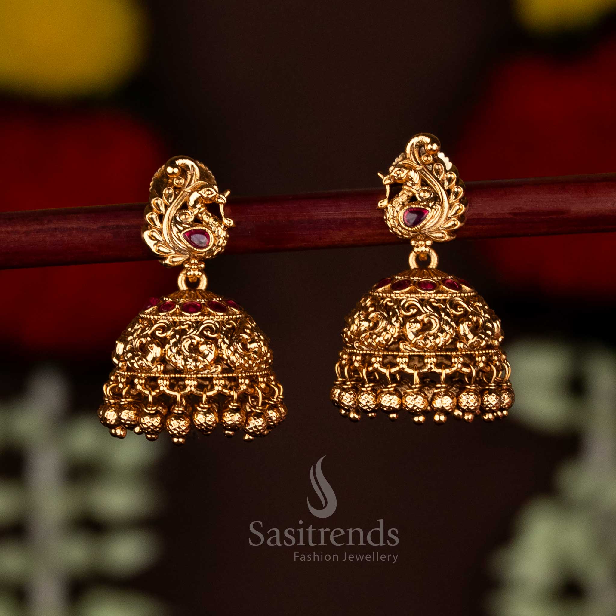 Charming ruby matte gold plated peacock temple small jhumka earrings designed for cultural festive occasions and ethnic elegance by Sasitrends