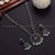 Radiate charm with ruby-hued stones in this classic Oxidised German Silver necklace with pearl earrings