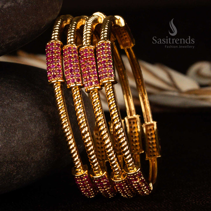 Micro gold plated traditional bangles set with radiant Ruby American diamond stones and ruby-studded floral motifs – a captivating ethnic jewellery piece for bridal and festive elegance by Sasitrends