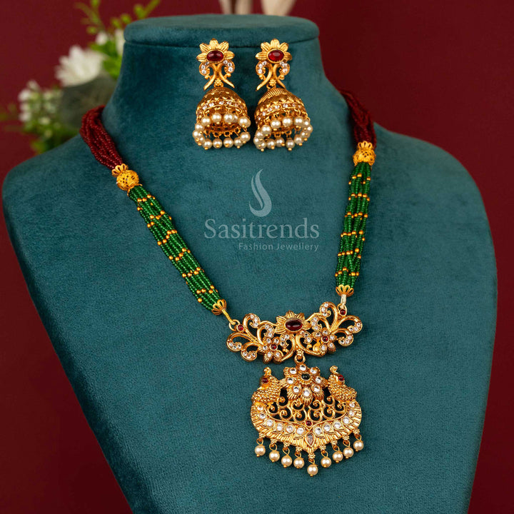 Matte gold plated necklace with a royal peacock pendant and contrasting ruby-green beads – a vibrant festive pick for traditional ensembles – Sasitrends