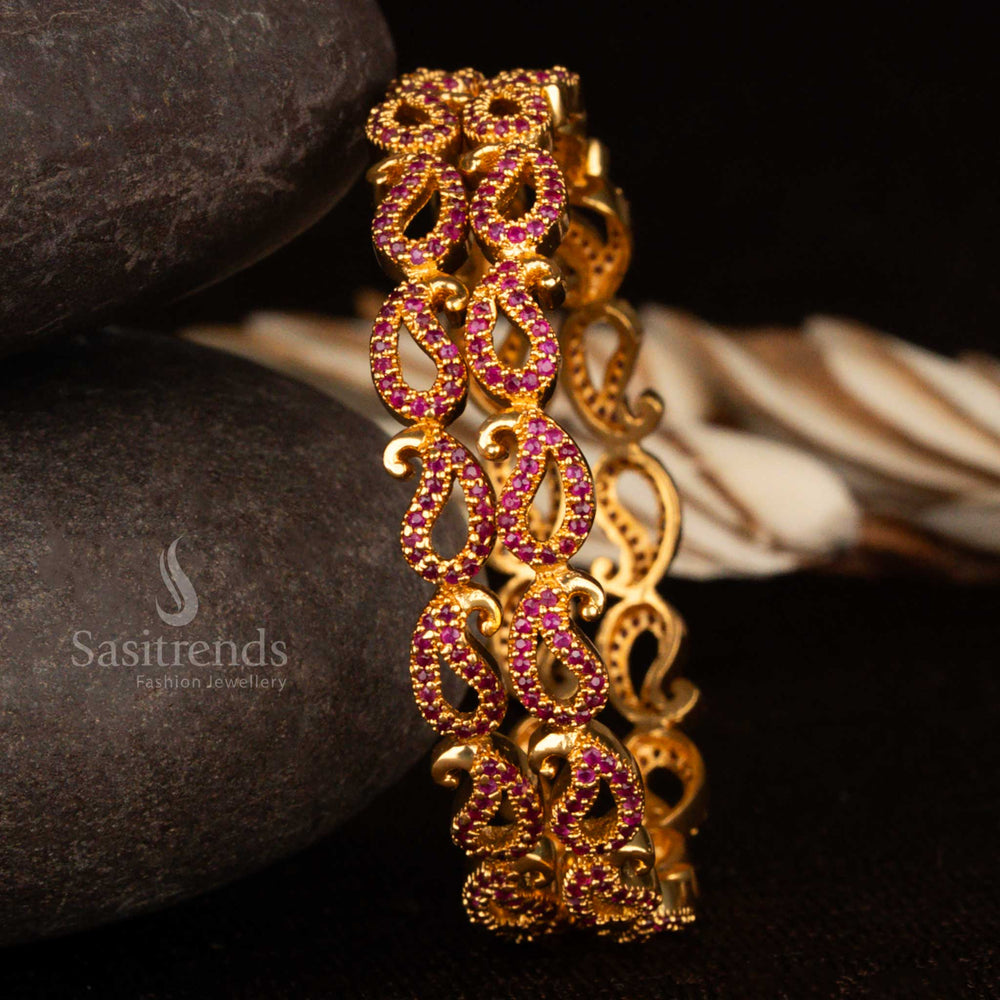 Micro gold mango design bangles studded with deep ruby American diamond stones – a striking ethnic jewellery piece with a 1-year guarantee, crafted for regal celebrations by Sasitrends
