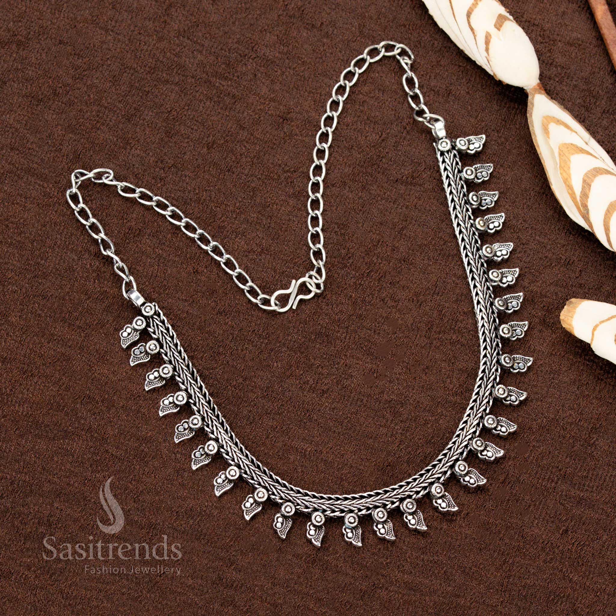 Exquisite oxidised German silver short necklace featuring a stunning tribal design, unique arrow-shaped dangling motifs, and an antique finish—perfect for Navaratri outfits - Sasitrends