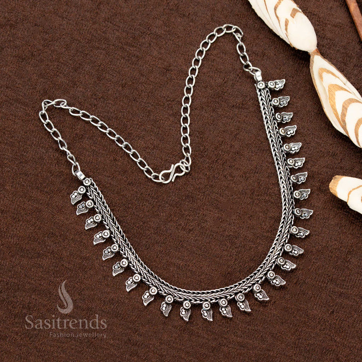 Exquisite oxidised German silver short necklace featuring a stunning tribal design, unique arrow-shaped dangling motifs, and an antique finish—perfect for Navaratri outfits - Sasitrends