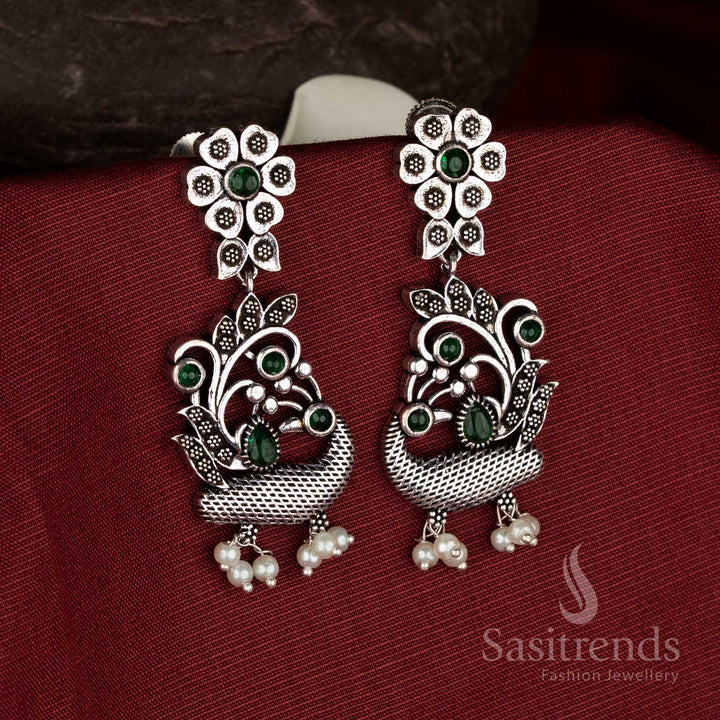Earthy charm oxidised silver floral peacock green pearl drop earrings for ethnic jewellery - Sasitrends