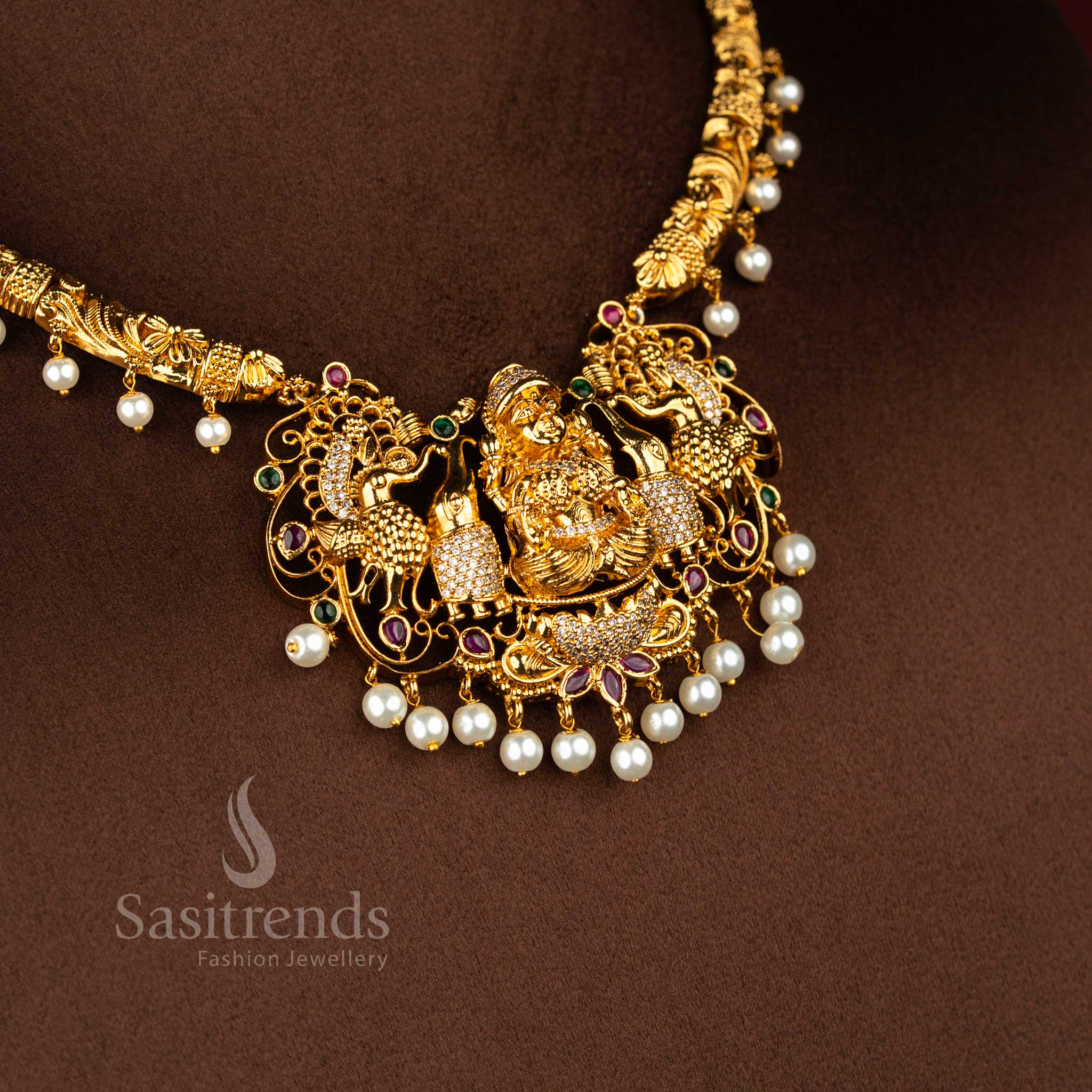 Opulent charm matte finish ornament featuring divine Lakshmi icon framed by artistic peacock carving enriched with colourful multi embellishments for cultural occasions – Sasitrends