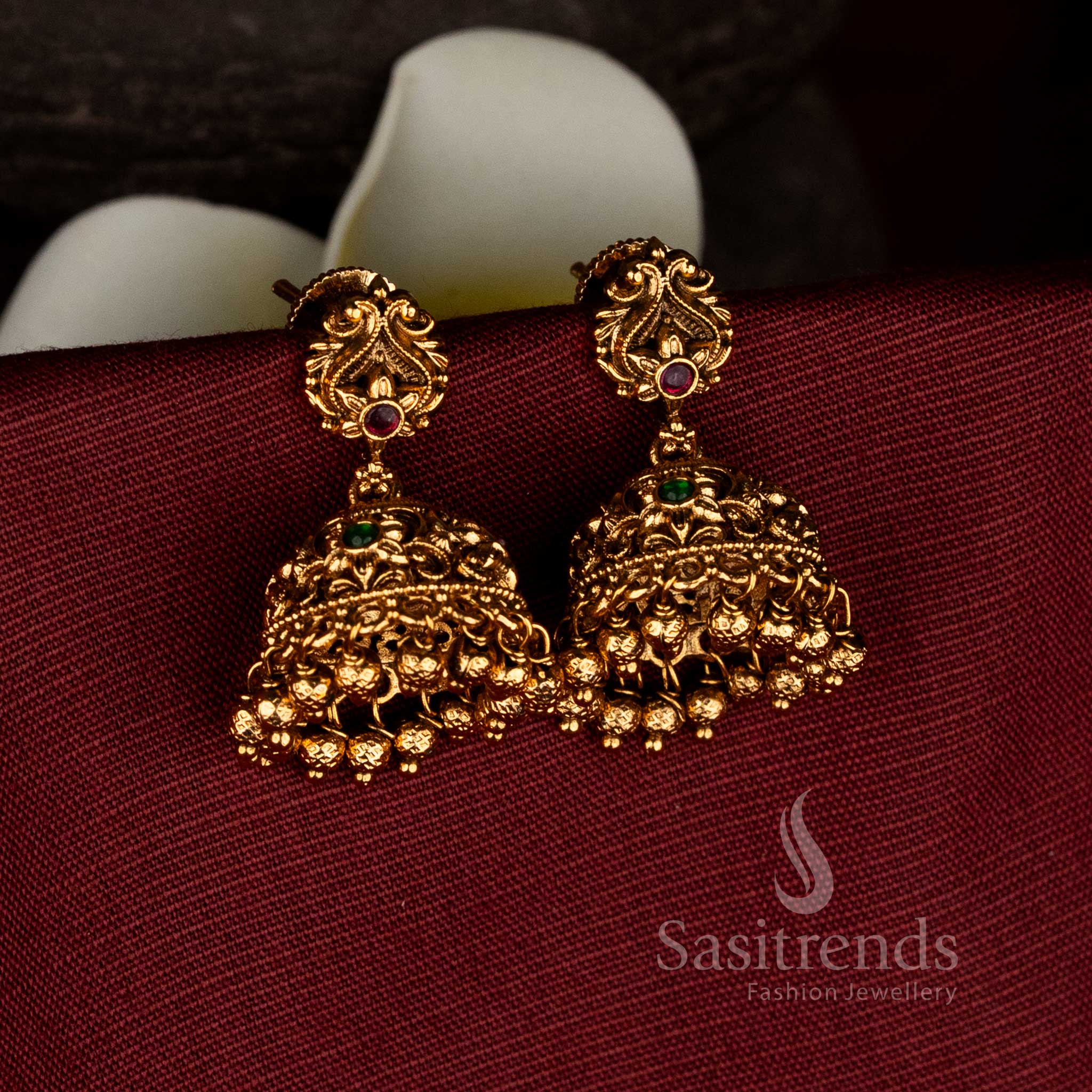 Regal tradition matte gold plated peacock floral filigree ruby green jhumkas with golden ghungroos for ceremonial elegance jewellery - Sasitrends