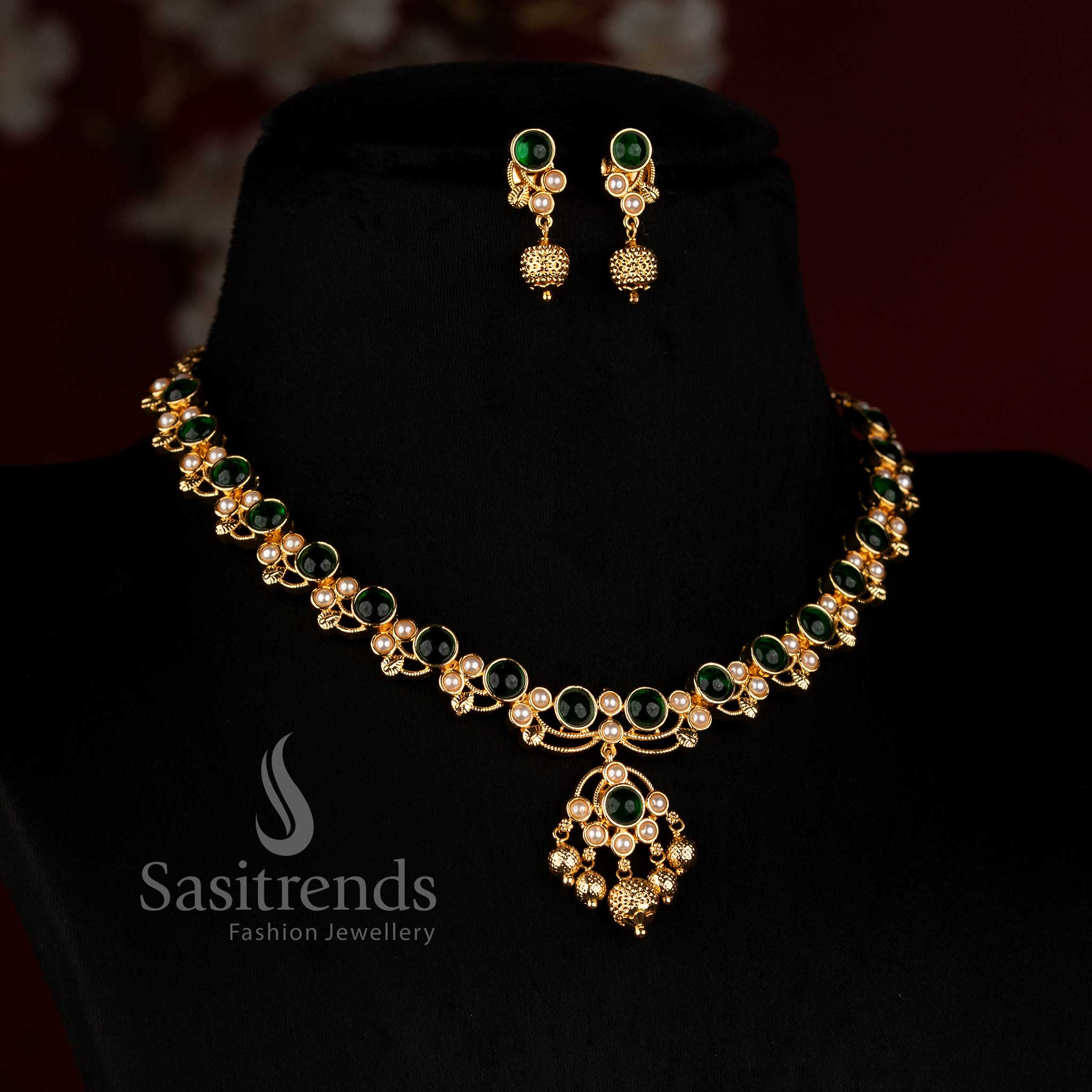 Sasitrends 24K Micro Gold Plated Pavalam Necklace Set adorned with pearl accents, repeated round Pavalam designs, traditional floral golden detailing, elegant statement pendant and matching earrings