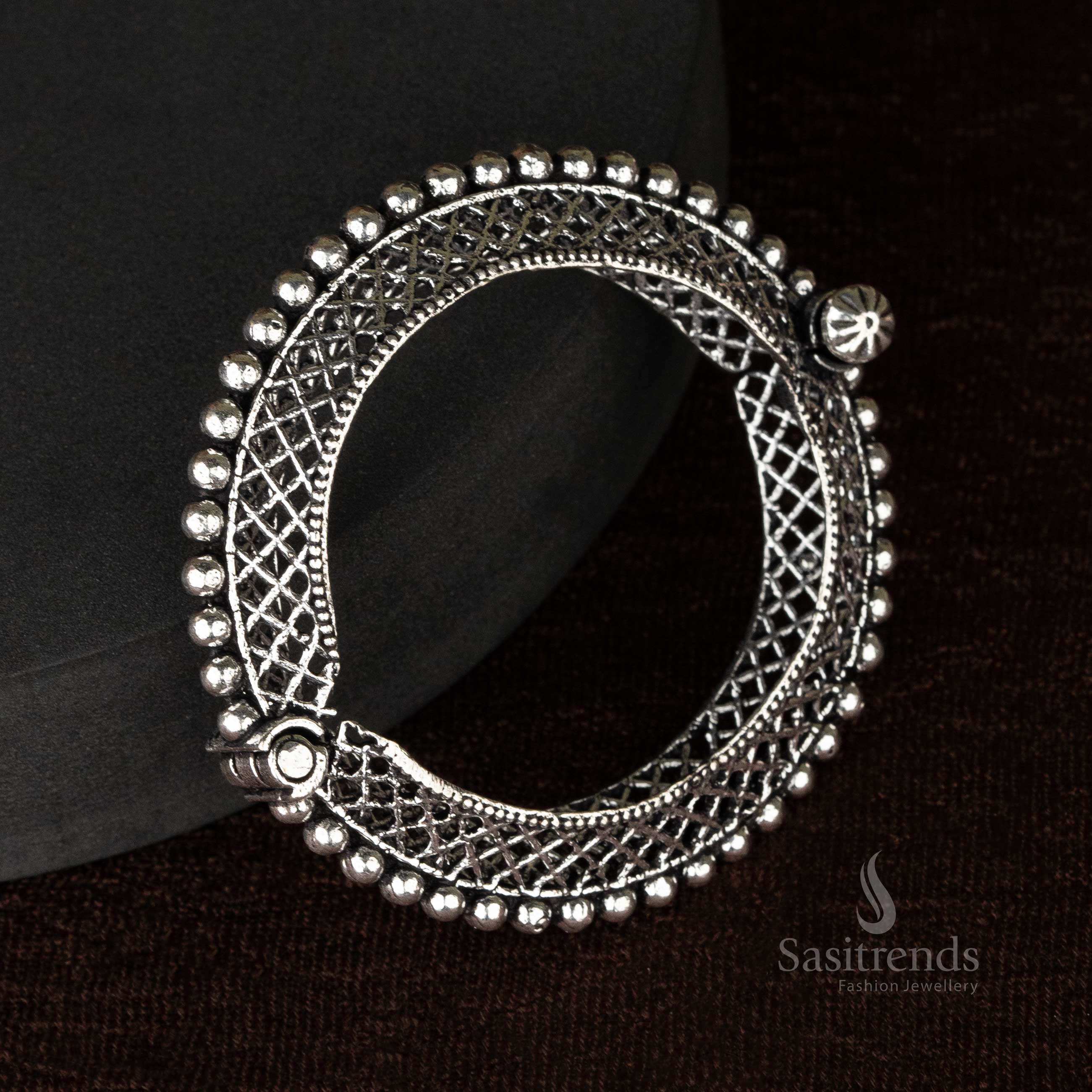 Ethnic oxidized kada bangles showcasing a combination of floral and elephant motifs, handcrafted for women - Sasitrends
