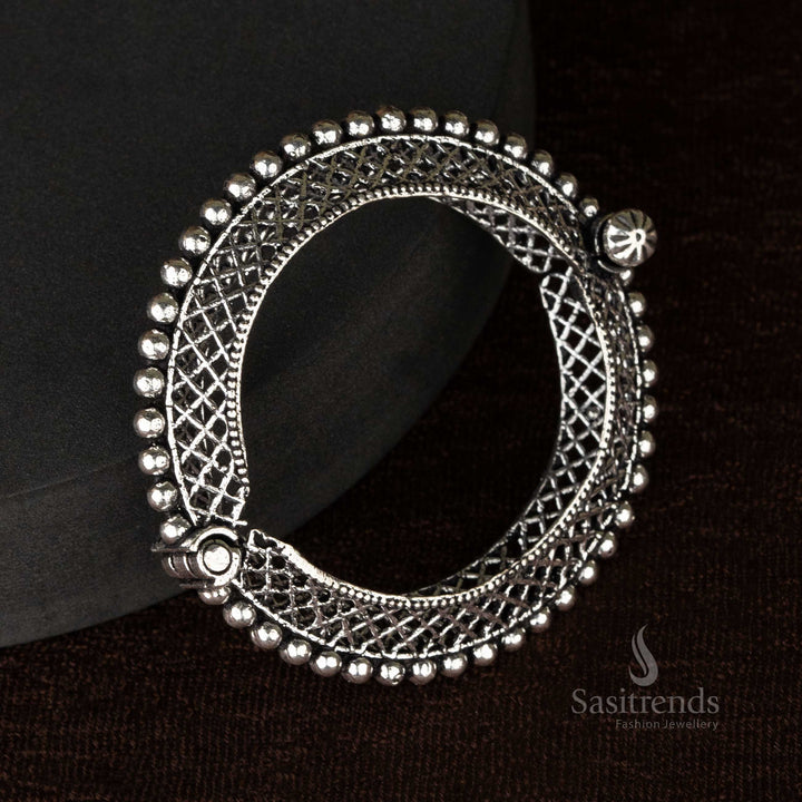 Ethnic oxidized kada bangles showcasing a combination of floral and elephant motifs, handcrafted for women - Sasitrends