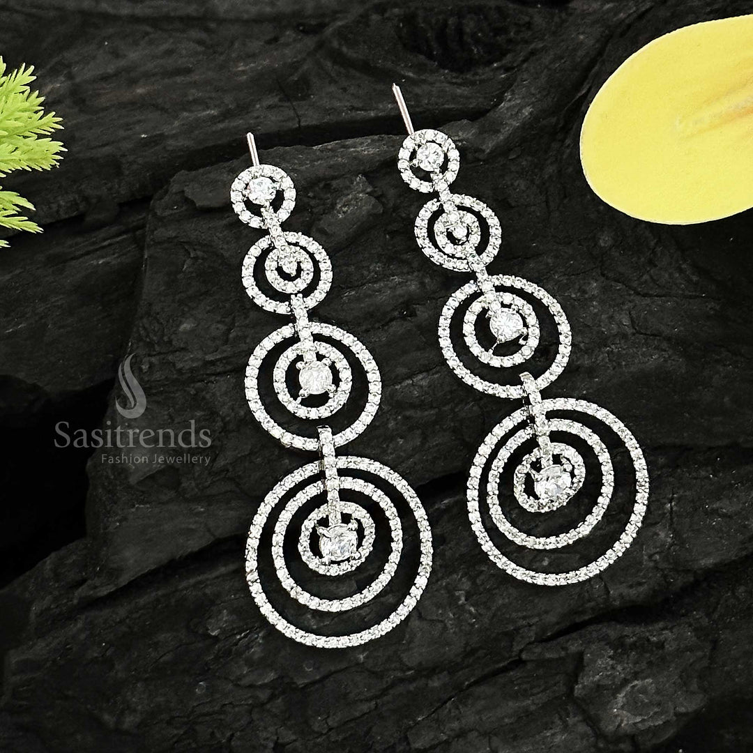 Captivating rhodium silver plated concentric circles dangler earrings adorned with American Diamond stones – Modern elegance partywear jewellery for stylish women – Sasitrends