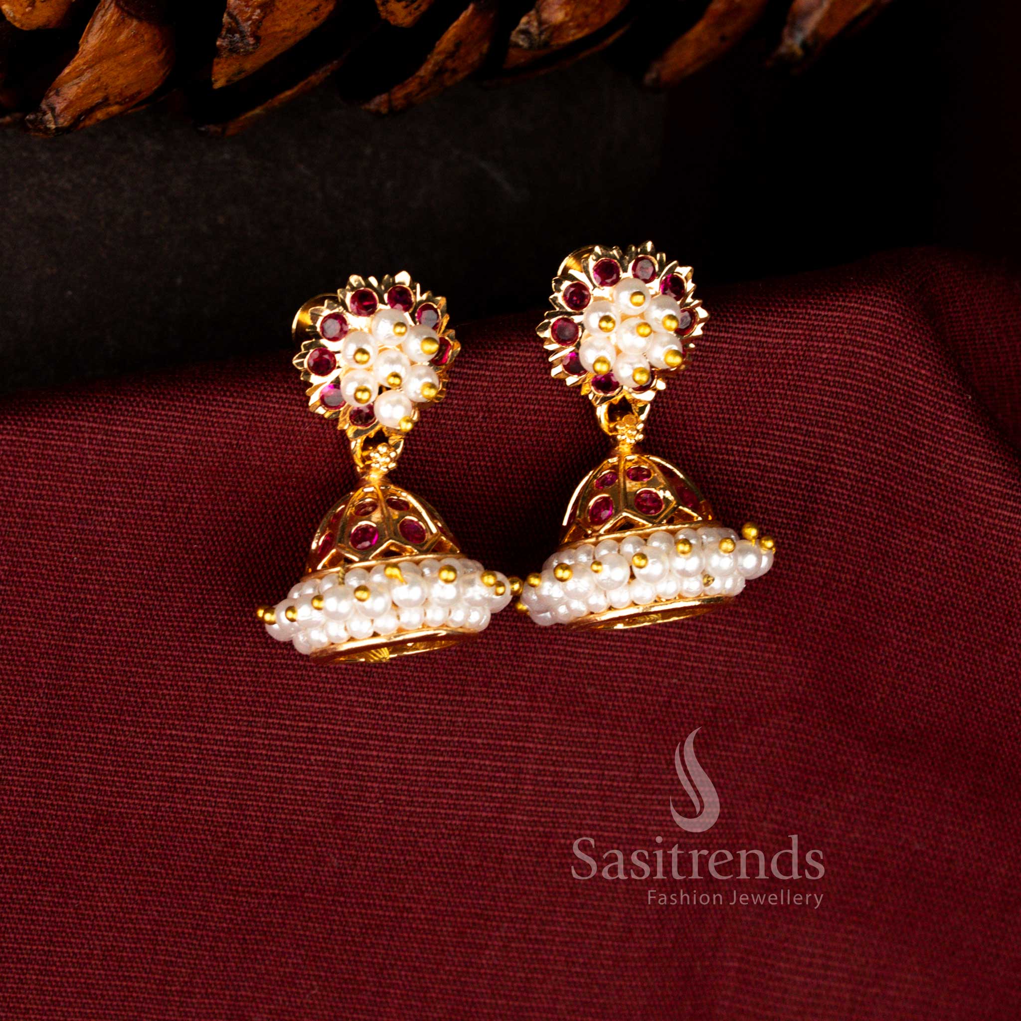 Classic traditional earrings in ruby designed with luminous AD stones, clustered pearls and graceful dome jhumka for cultural events – Sasitrends