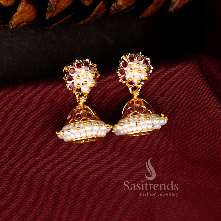 Classic traditional earrings in ruby designed with luminous AD stones, clustered pearls and graceful dome jhumka for cultural events – Sasitrends