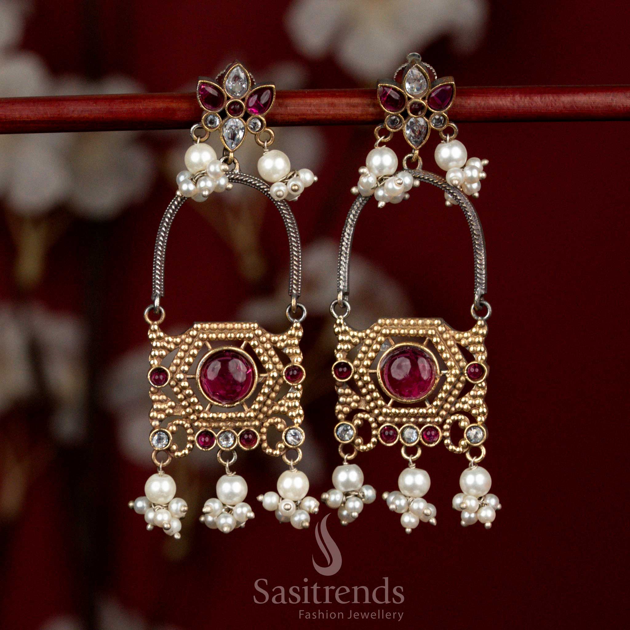 Refined dual tone oxidised silver earrings adorned with white-ruby Monalisa stones, sculpted floral arch motifs and delicate pearl cluster drops for festive ethnic styling - Sasitrends