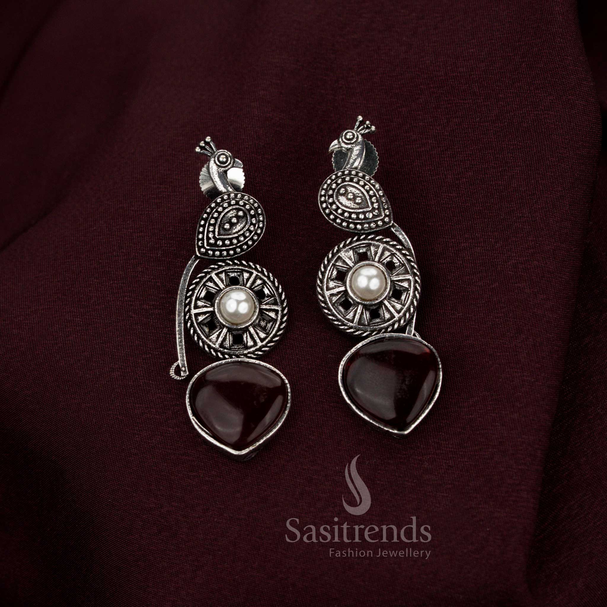 Magnificent maroon oxidised peacock earrings featuring baroque-inspired artistry crafted with pearl drops for eternal cultural charm aristocratic refinement and heritage jewellery grace – Sasitrends