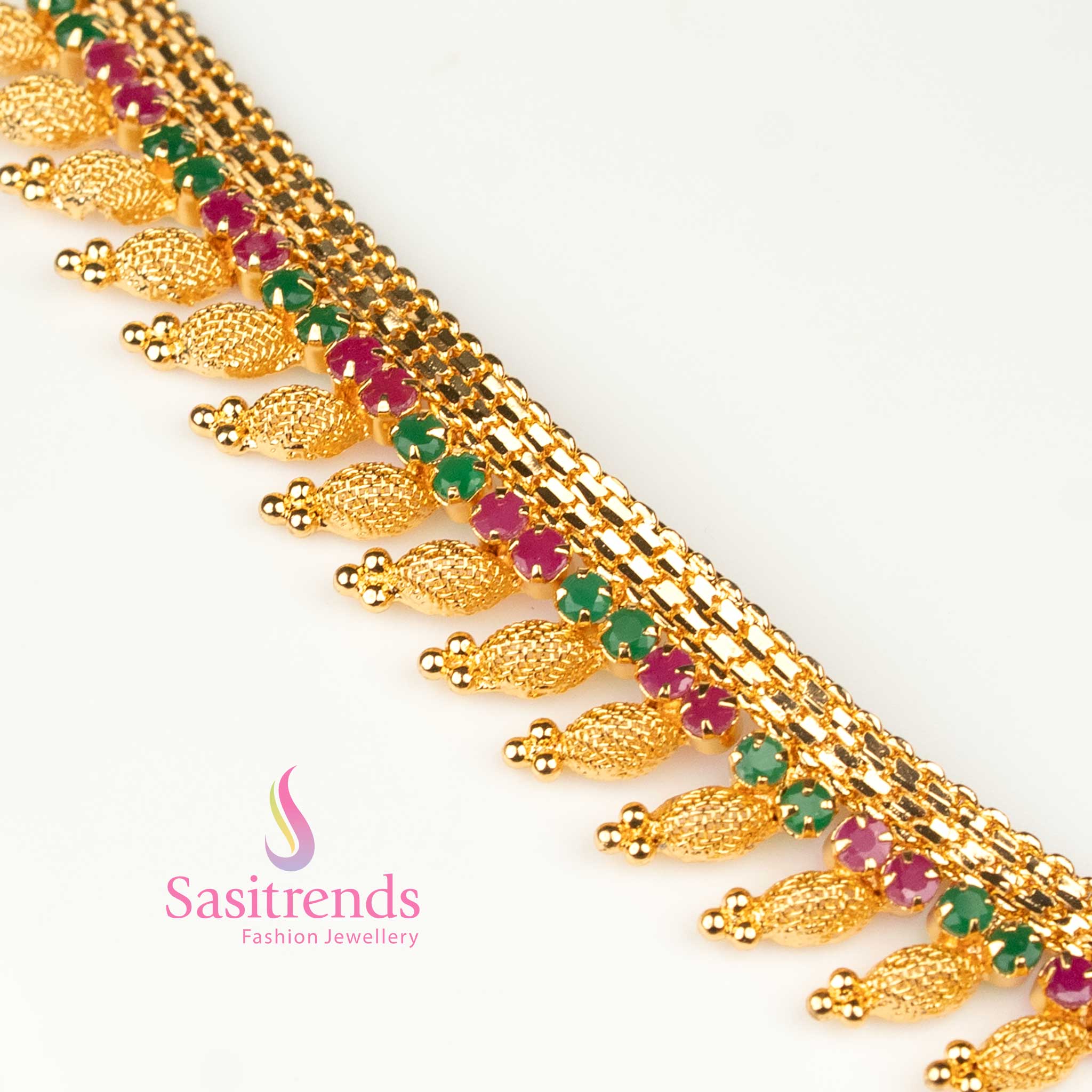 Regal micro gold plated ruby-green AD necklace featuring a tilak-inspired pendant, beautifully crafted for festive elegance and graceful appeal – Sasitrends