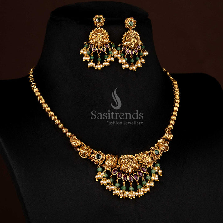 Luminous ruby-green matte gold plated floral dual peacock necklace with pearl danglings, crafted to wear for cultural ceremonies and grand temple functions – Sasitrends