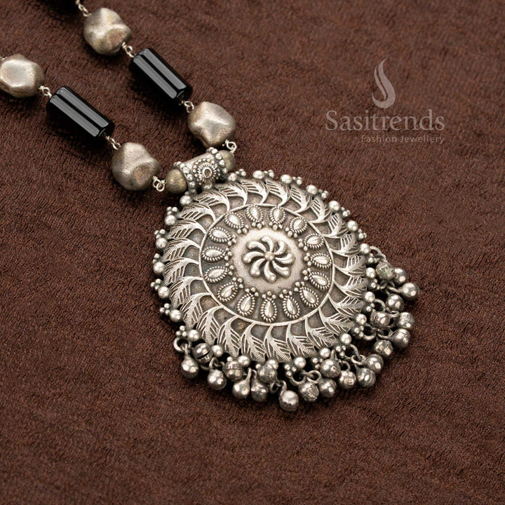 Exquisite oxidised traditional floral statement necklace featuring black stone accents, a bold round pendant, and intricately designed matching earrings, perfect for festive saree jewellery lovers - Sasitrends