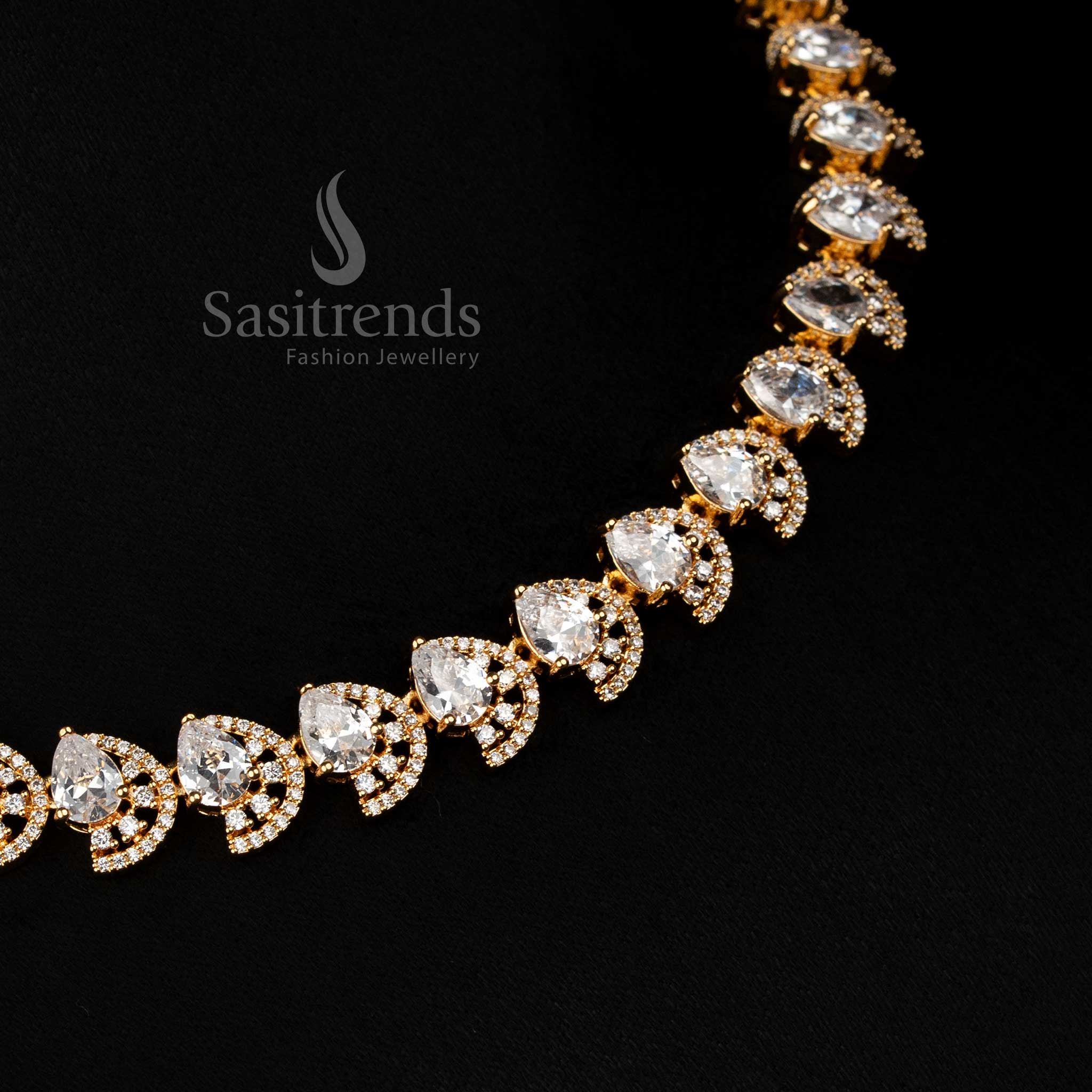 Luxurious white dual tone gold plated necklace with infinity teardrop design and AD stones for stylish parties - Sasitrends